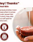 A person is holding a Scalp and Body Scrubber - Sedona Red by Scrub-dub™ to exfoliate and cleanse their skin.