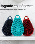 Scrub-Dub® scalp scrubber in teal, blue, and red; antimicrobial dual-sided tool for scalp and body care.