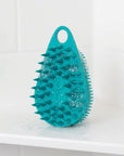 Scrub-Dub® scalp scrubber in teal color, designed for effective scalp cleaning and exfoliation.