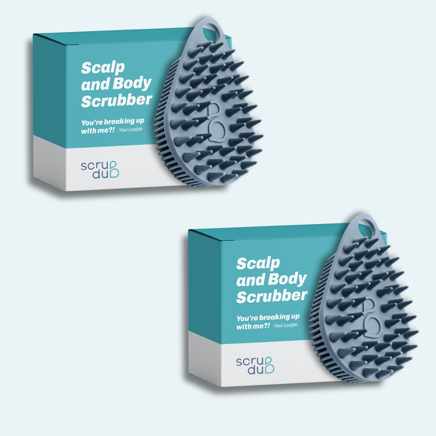 Two boxes of The scrub-dub® Scalp and Body Scrubber include blue exfoliating brushes from the brand Scrub-dub®, with the text: &quot;You&#39;re breaking up with me?! - Your Loofah.&quot; They are perfect for gently exfoliating your skin while also serving as an effective scalp scrubber.