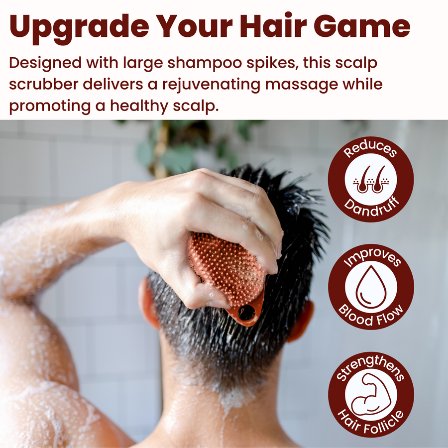 A man is using the Scrub-dub™ Sedona Red Scalp and Body Scrubber to cleanse and exfoliate his hair while washing it with a hair brush.