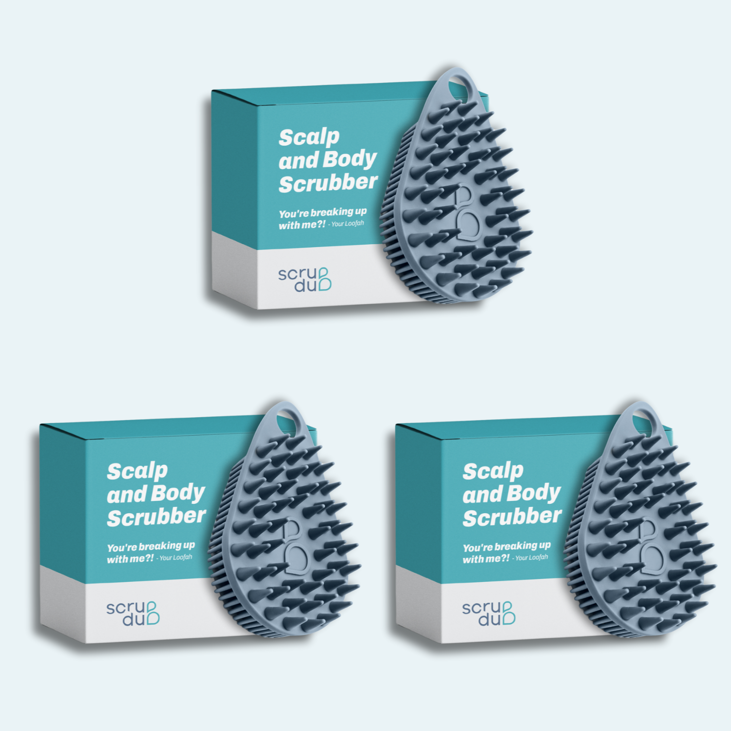 Three boxes in teal and gray, labeled &quot;The scrub-dub® Scalp and Body Scrubber&quot; by Scrub-dub®, showcase spiky scrubbers ideal for exfoliating the skin.