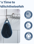 A black Scalp and Body Scrubber with gentle bristles hangs on a hook in a tiled bathroom, accompanied by icons highlighting it being American-made, travel-friendly, and 100% recyclable.